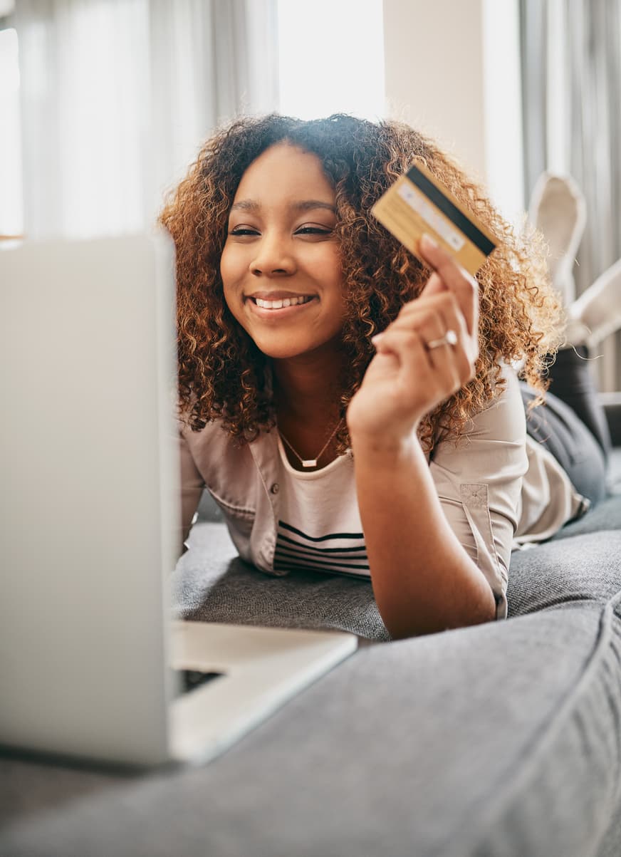 A customer happily shopping online at home