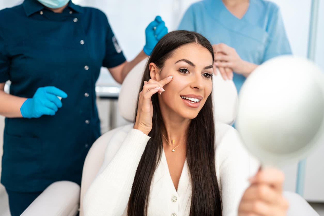 A patient relaxing in a bright, calm med-spa treatment room during a consultation